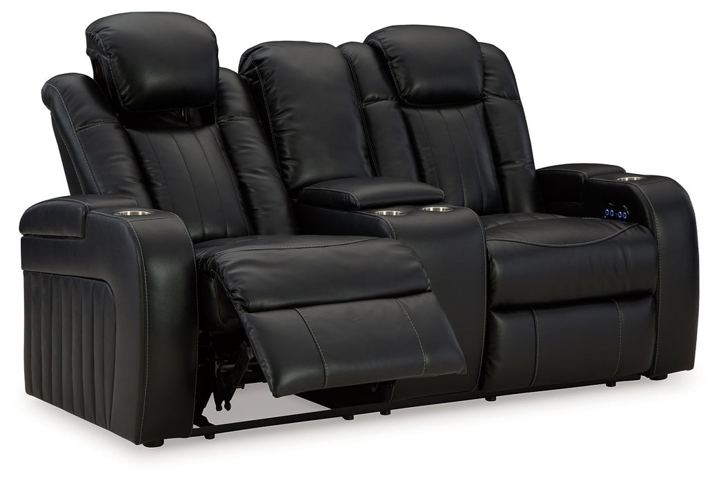Caveman Den - Power Reclining Loveseat with Console/ Adj Hdrst - Midnight
